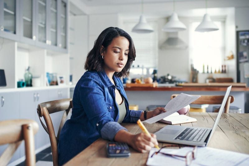 Woman learning about geothermal heat pump tax credits in 2023. Reliant Heating & Cooling blog image.